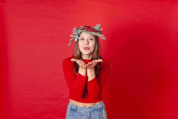 Beautiful woman with a Christmas wreath