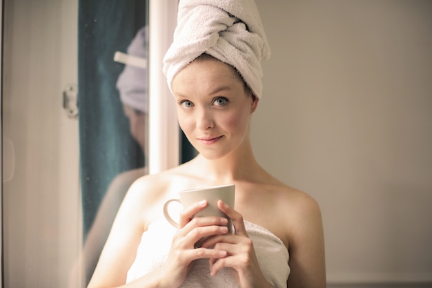 Beautiful woman with coffee in the morning