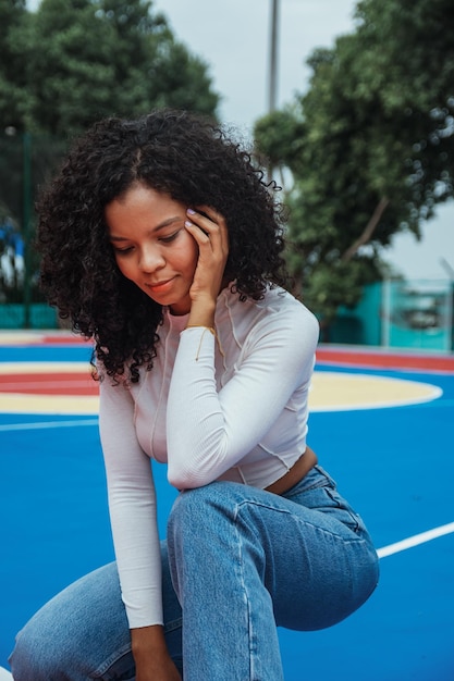 Beautiful woman with dark and curly skin