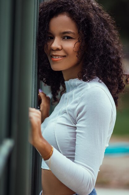 Beautiful woman with dark and curly skin