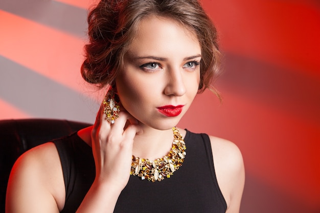 Beautiful woman with evening make-up. Jewelry and Beauty.