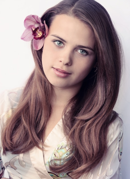 Beautiful woman with a flower in her hair