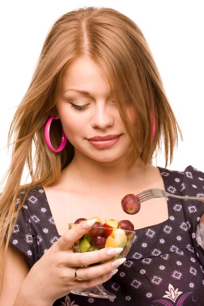 beautiful woman with glass bowl of fruit salad