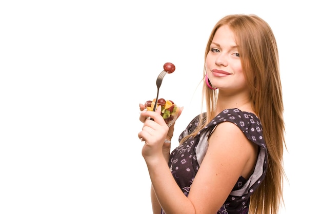 beautiful woman with glass bowl of fruit salad