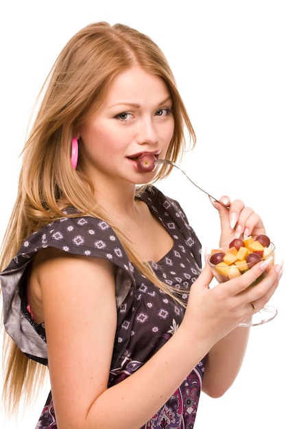 beautiful woman with glass bowl of fruit salad