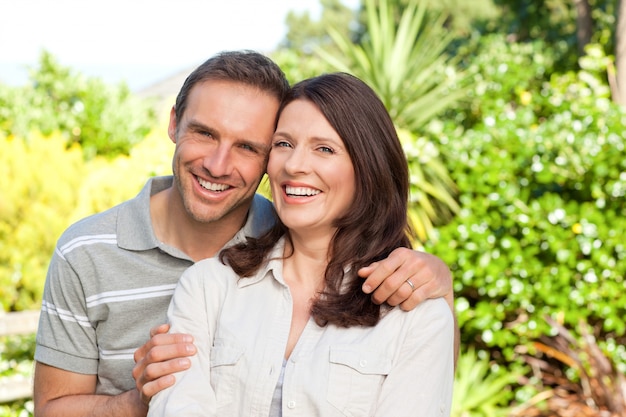 Beautiful woman with her husband in the garden