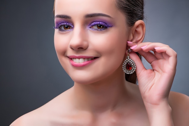 Beautiful woman with jewellery in fashion concept