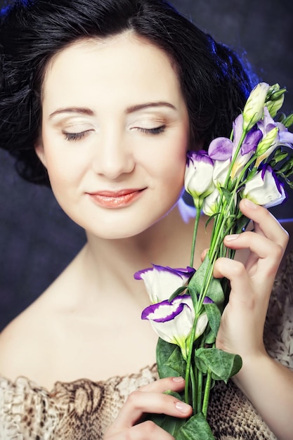 Beautiful woman with lilac flower