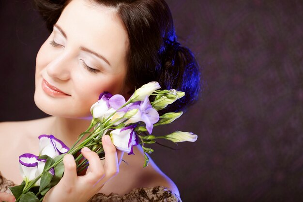 Beautiful woman with lilac flower