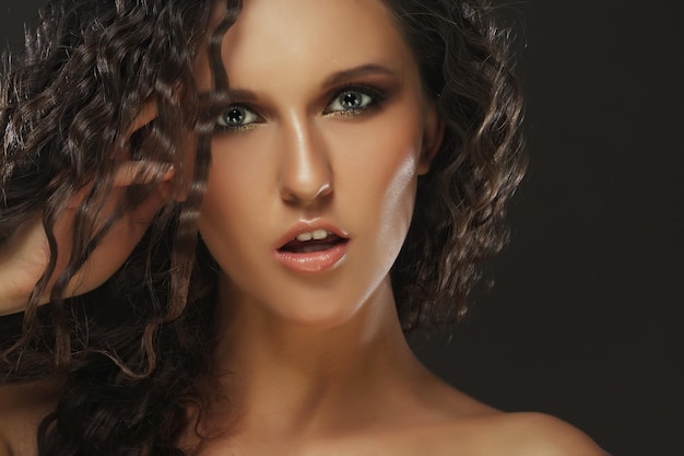 Beautiful woman with long curly hairs