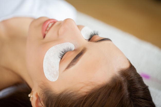 Beautiful Woman with long eyelashes in a beauty salon