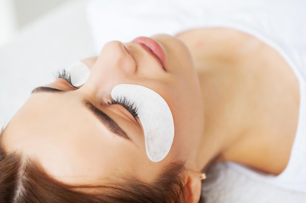 Beautiful Woman with long eyelashes in a beauty salon