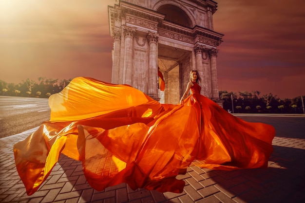 Beautiful woman with long red dress