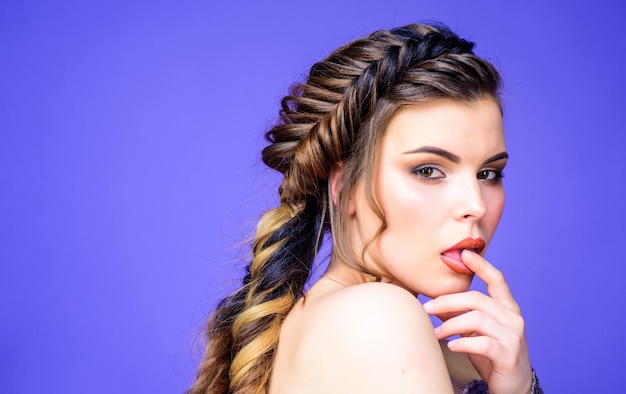 Beautiful woman with luxury hair. beauty fashion. skincare and makeup. sexy woman with fashion makeup. best hairstyle. volume hair. hairdresser salon. copy space. sexy woman on purple background.