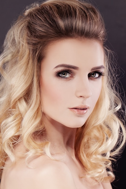 Beautiful Woman with Makeup and Wavy Permed Hairstyle