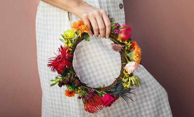 Beautiful woman with a midsummer floral wreath