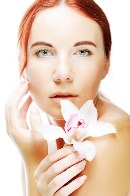 Beautiful woman with orchid flower