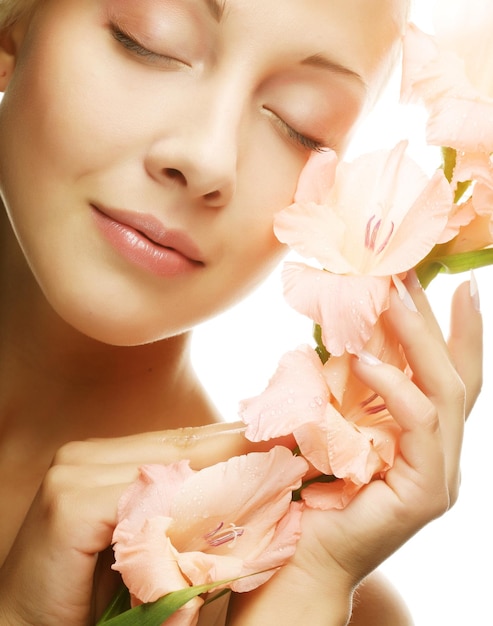 Beautiful woman with pink flower