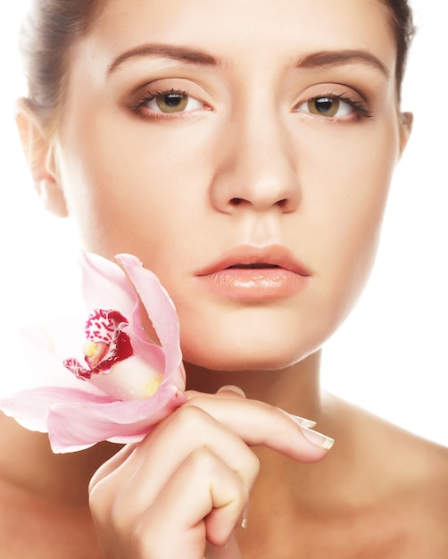 Beautiful woman with pink flower