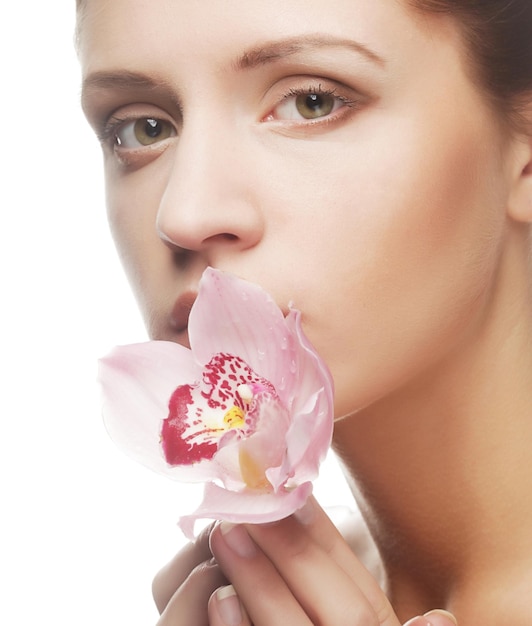 Beautiful woman with pink flower