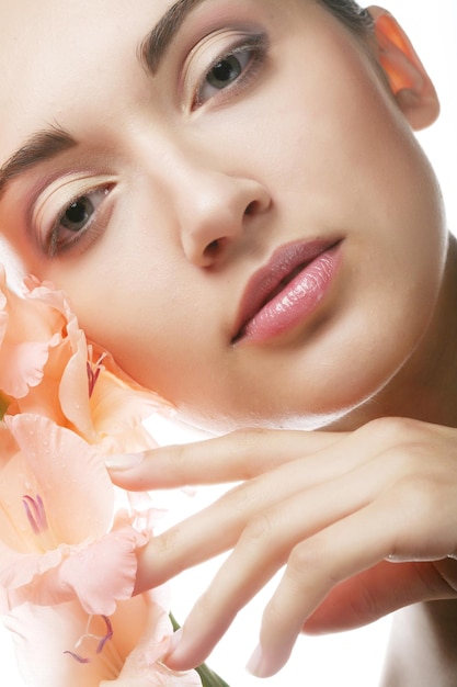 Beautiful woman with pink flower