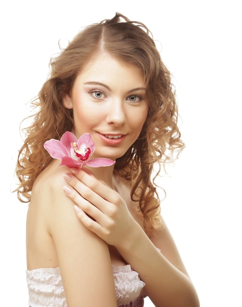 Beautiful woman with pink orchid