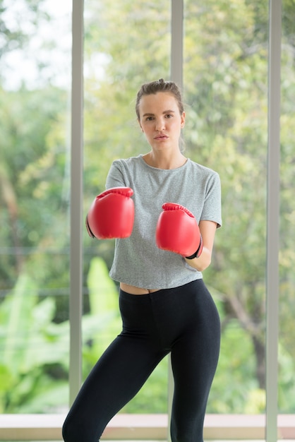 Beautiful woman with the red boxing gloves