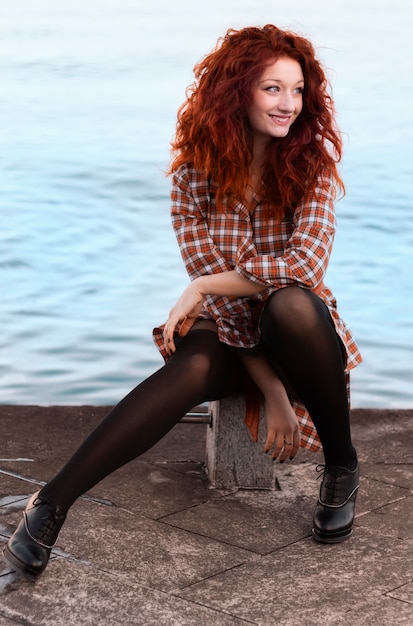 Beautiful woman with red hair smiling