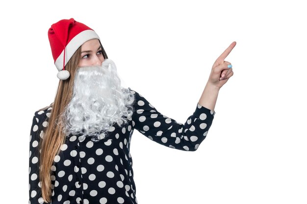 beautiful woman with santa beard points finger to side isolated on white background