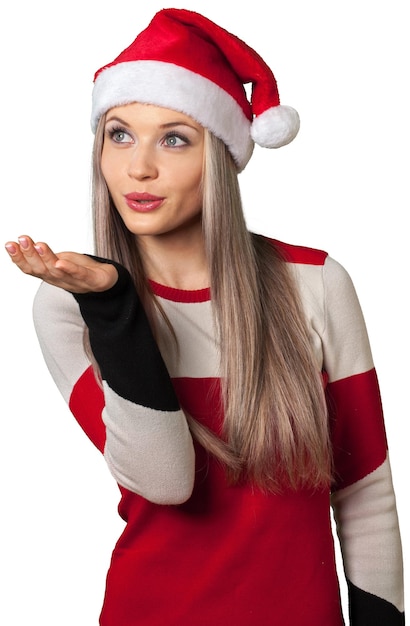 Photo beautiful woman with santa hat blowing a kiss - isolated