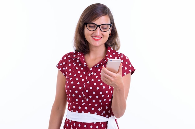 beautiful woman with short hair wearing eyeglasses isolated against white wall