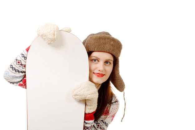 Beautiful woman with a snowboard in studio