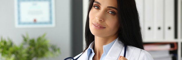 Beautiful woman with stethoscope in hospital