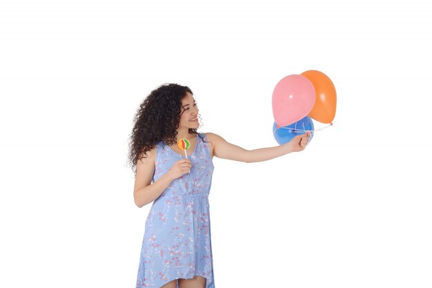 Bella donna con dolce lecca-lecca e baloons.