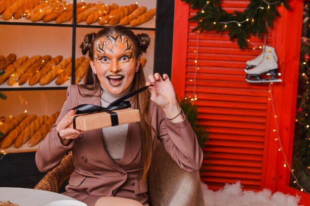 Beautiful woman with tiger makeup New year concept Symbol of the year