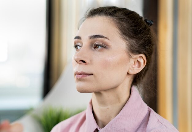 Beautiful woman with trendy makeup pink lipstick and wellkept skin