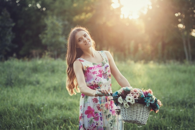 Beautiful woman with vintage bike