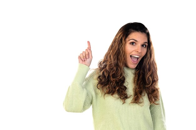 Beautiful woman with wavy hair isolated on a white wall