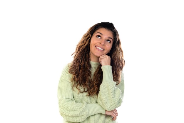 Beautiful woman with wavy hair isolated on a white wall