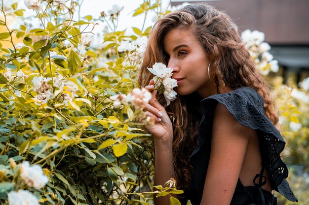 Beautiful woman with white flower on spring time