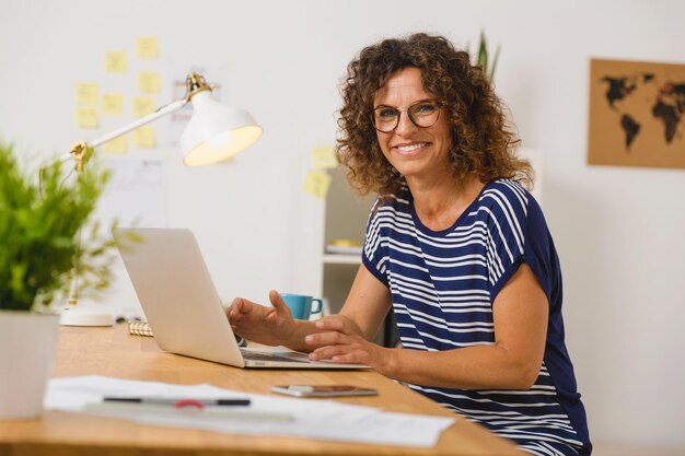 Beautiful woman working at the office