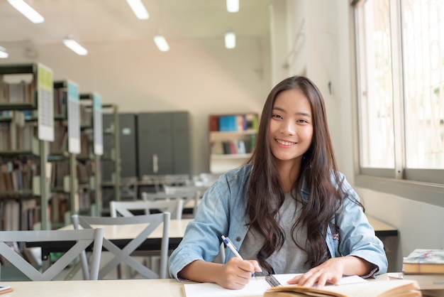 Beautiful women are reading and researching in the university library