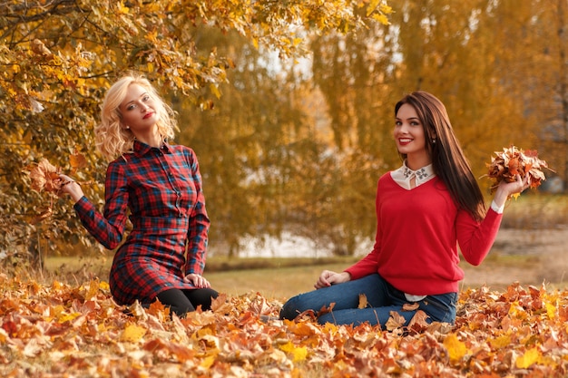 beautiful women in autumn park