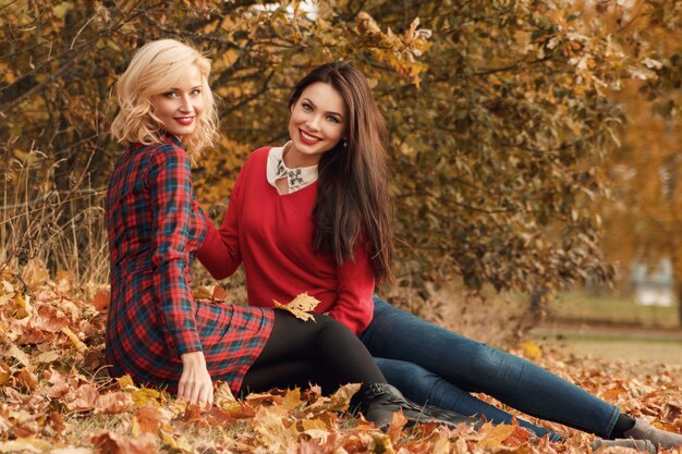 beautiful women in autumn park