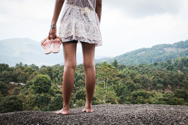 Beautiful women standing on the stone at mountain 