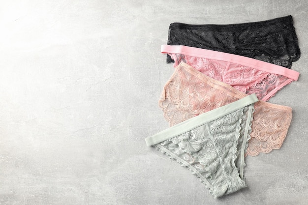 Photo beautiful womens panties on gray textured background