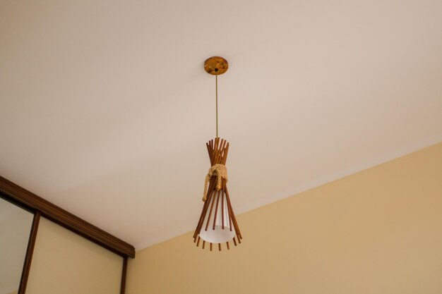 Beautiful wood chandelier on the ceiling