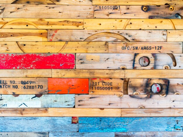 Beautiful wood wall decoration collage with variety of old wood planks and colors. The textured surface on used wood made a wall.