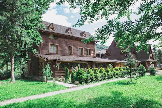 Beautiful wooden houses in the Carpathians in the forest