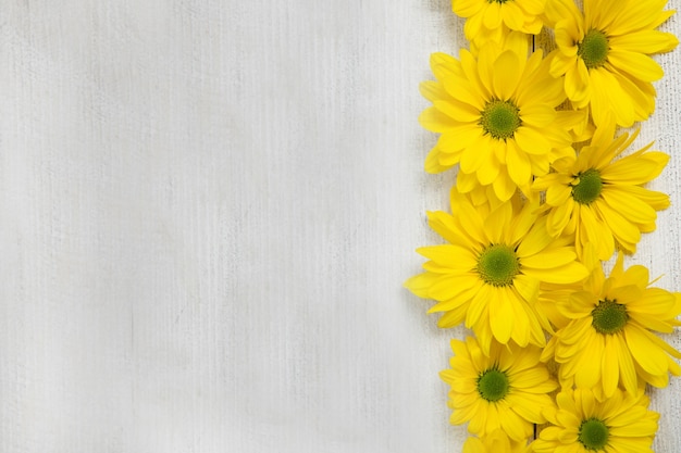 Beautiful yellow flowers on a wooden table